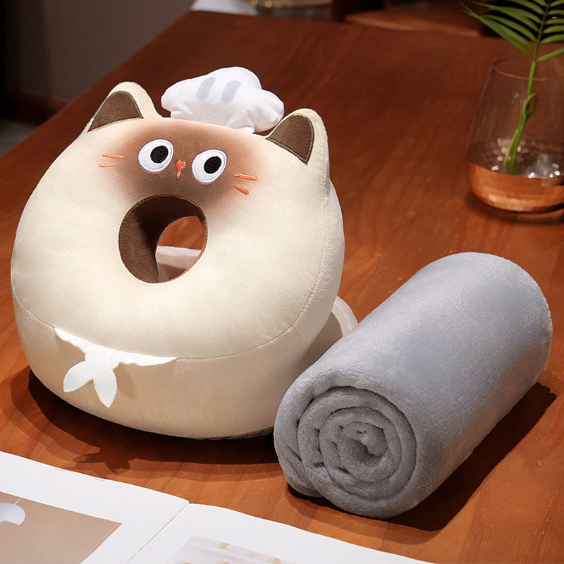Ergonomic baby head pillow with center hole and cuddly blanket in cat plush design