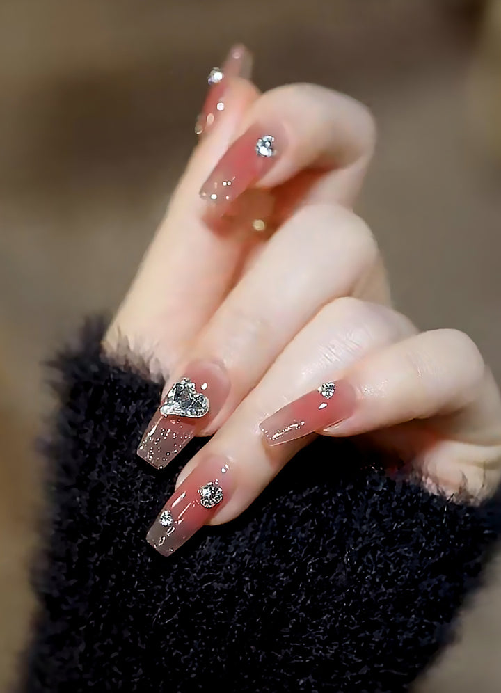 Acrylic nail set with elegant heart and rhinestone decorations Kalsten