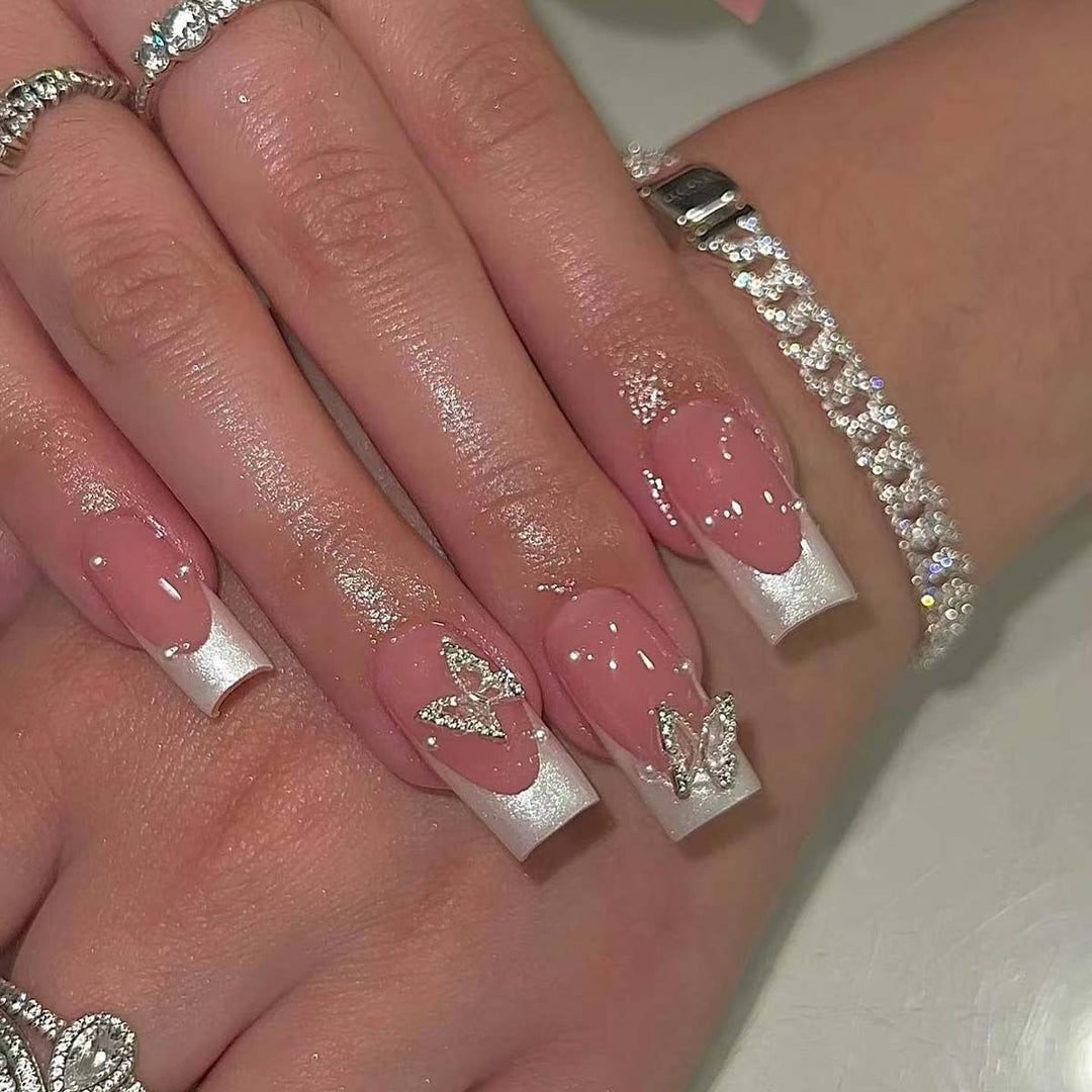 Creative French nails with glitter accents Kalsten