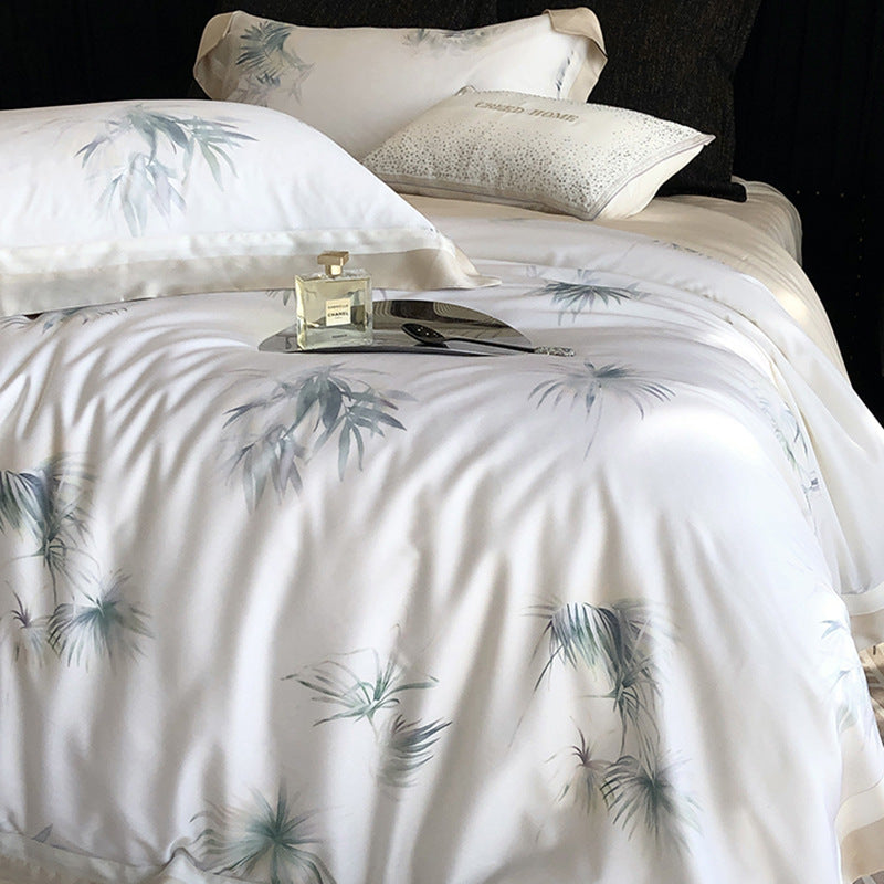Luxurious cotton satin bedding set with delicate leaf print, contrasting hem and fine piping