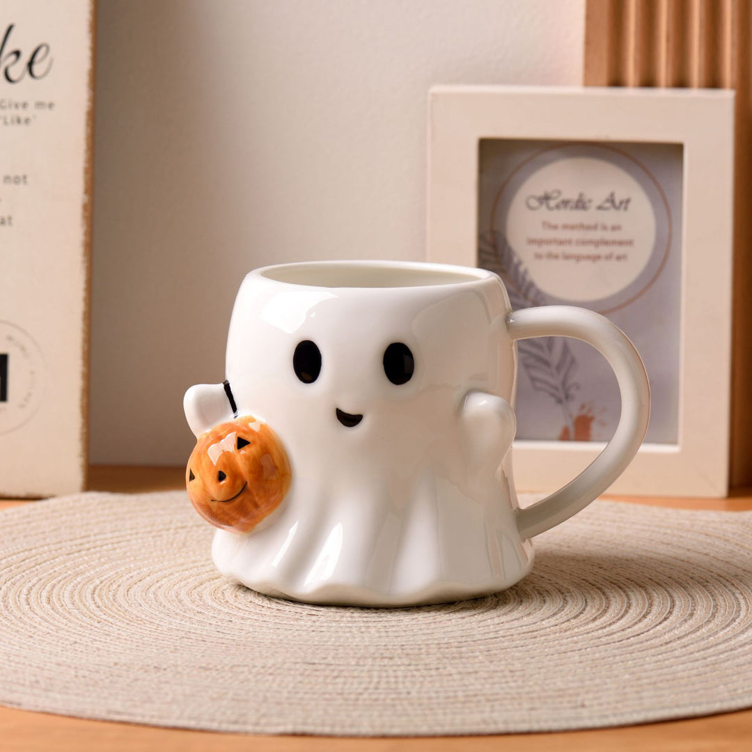 Ceramic mug with 3D ghost shape and pumpkin appliqué