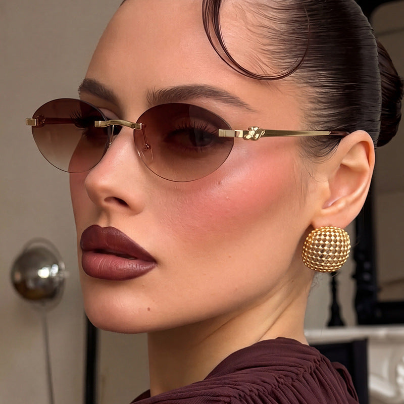 Women's elegant oval sunglasses with golden accents Kalsten