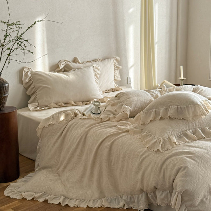 Cotton-linen bedding set with subtle jacquard floral pattern and ruffle trim