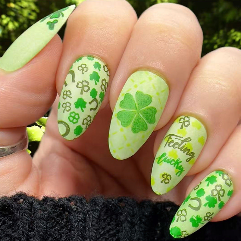 Art nail set with cheerful clover designs and casual lettering motifs Kalsten