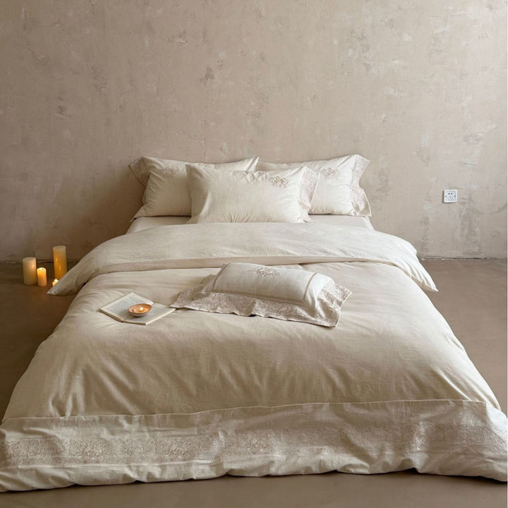 Fine linen bed linen set with floral tone-on-tone embroidery and hem detail
