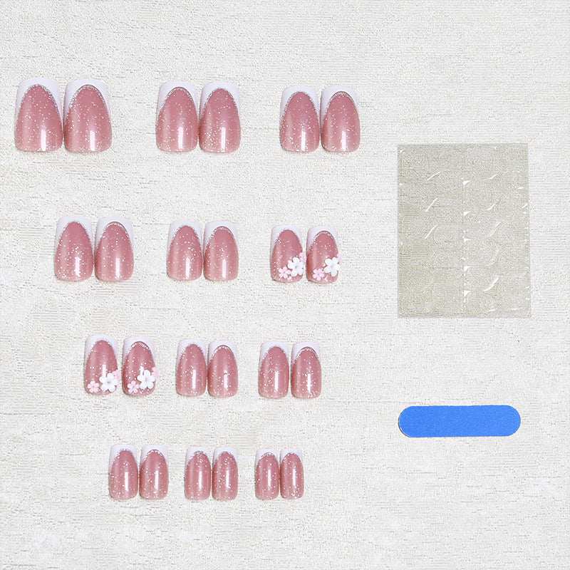 Acrylic nail set with elegant French tip and delicate floral decorations Kalsten