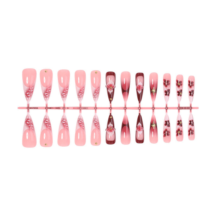 Artifical nail set with delicate floral design and glamorous accents Kalsten