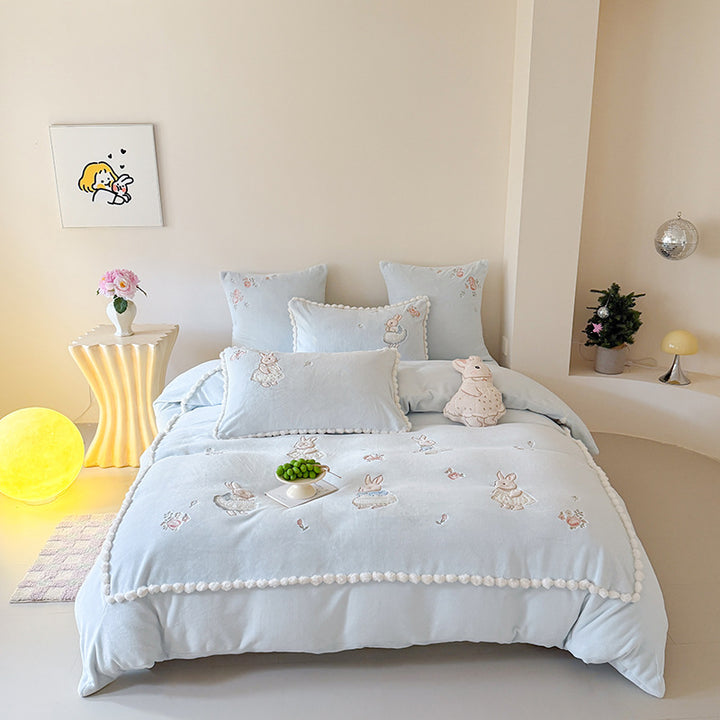 Cute cotton bedding set with embroidered bunny appliqués and pom-pom trim