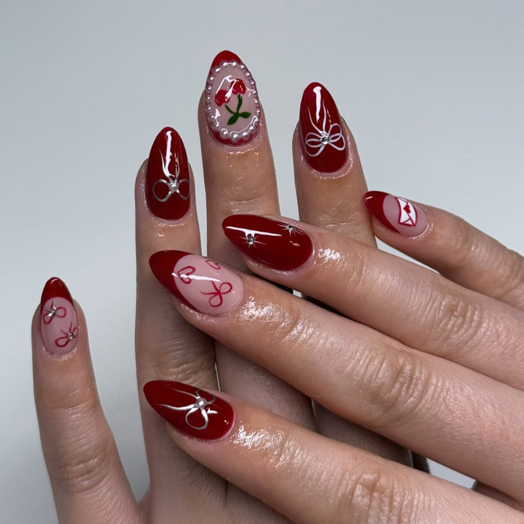 Artful nail designs with bow and rose motif Kalsten