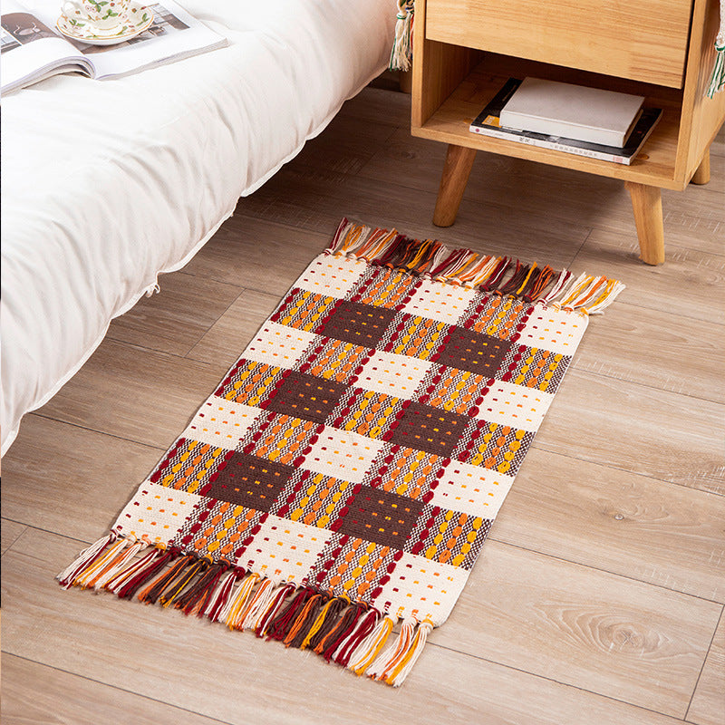 Woven colorful table runner with fringes and checkered structure