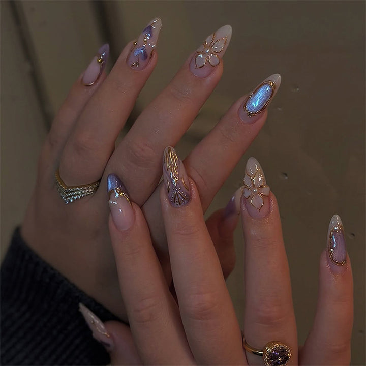 Artificial nail set with glamorous floral designs and creative glitter accents Kalsten