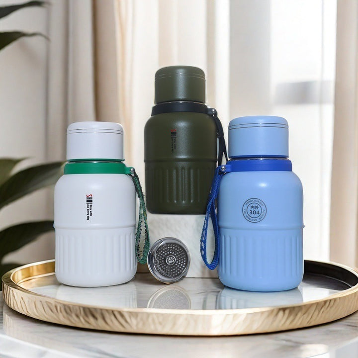 Insulated drinking bottle with integrated carrying strap Kalsten