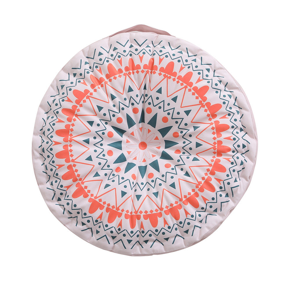 Round floor cushion with medal print, carrying handle and quilted padding