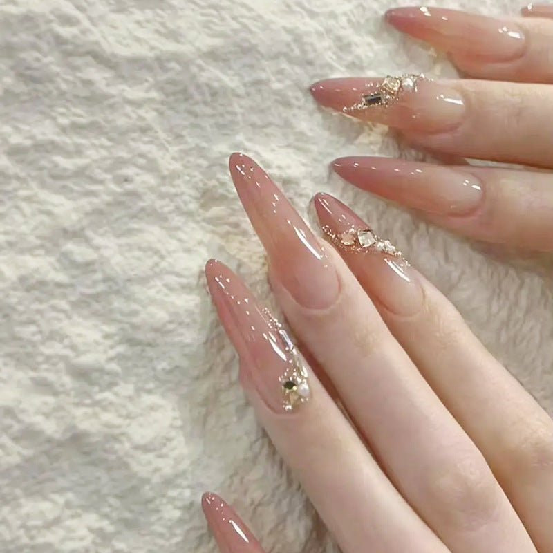 Artificial nail set with elegant ombre effect and glamorous embellishments Kalsten