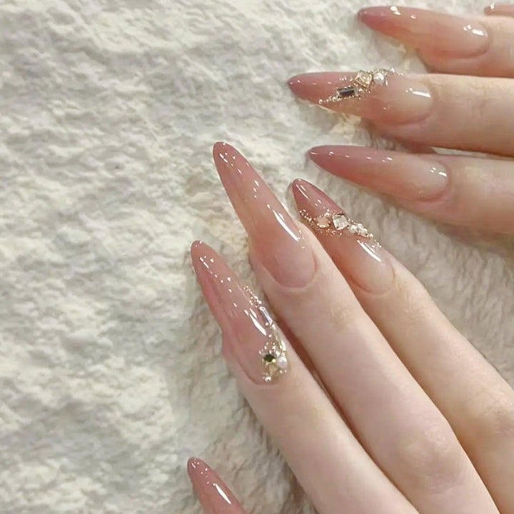 Artificial nail set with elegant ombre effect and glamorous embellishments Kalsten