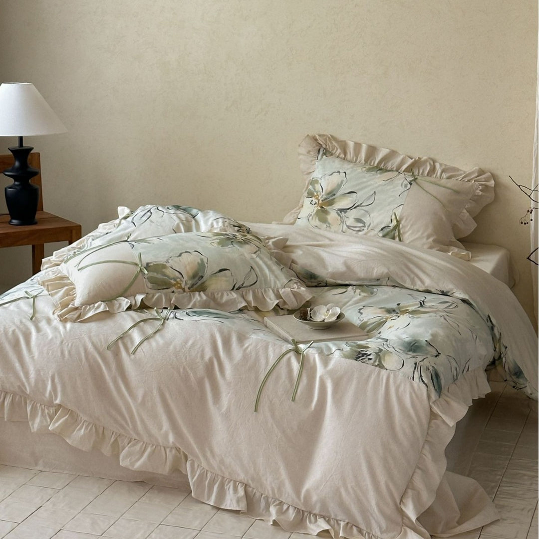 Duvet cover set made of cotton satin with watercolor magnolia print, ruffle, and tie ribbons