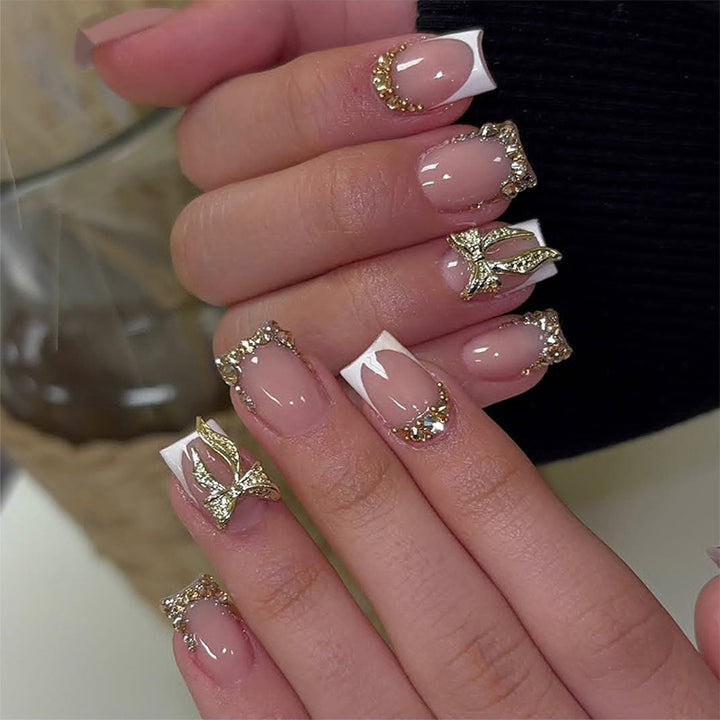 Nail art set with elegant glitter ornaments and stylish French tips Kalsten