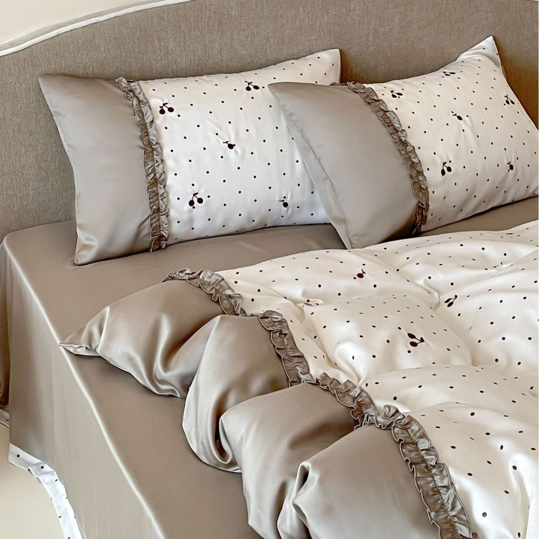 Satin bedding set with delicate ruffles and cherry pattern