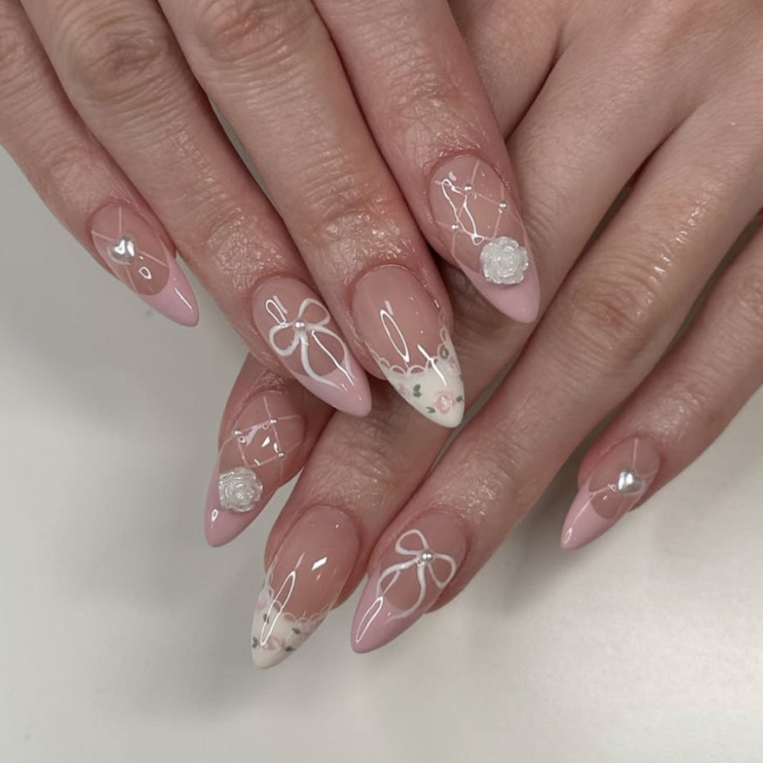 Artful nail art with floral details and bow embellishments Kalsten