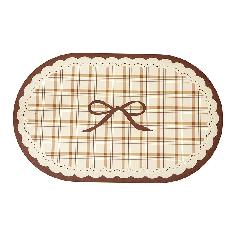 Rectangular wipeable placemat with checked pattern, wavy decorative edge and bow motif Kalsten