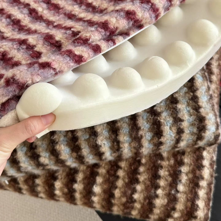 Knitted decorative cushion with wool blend and retro stripe texture