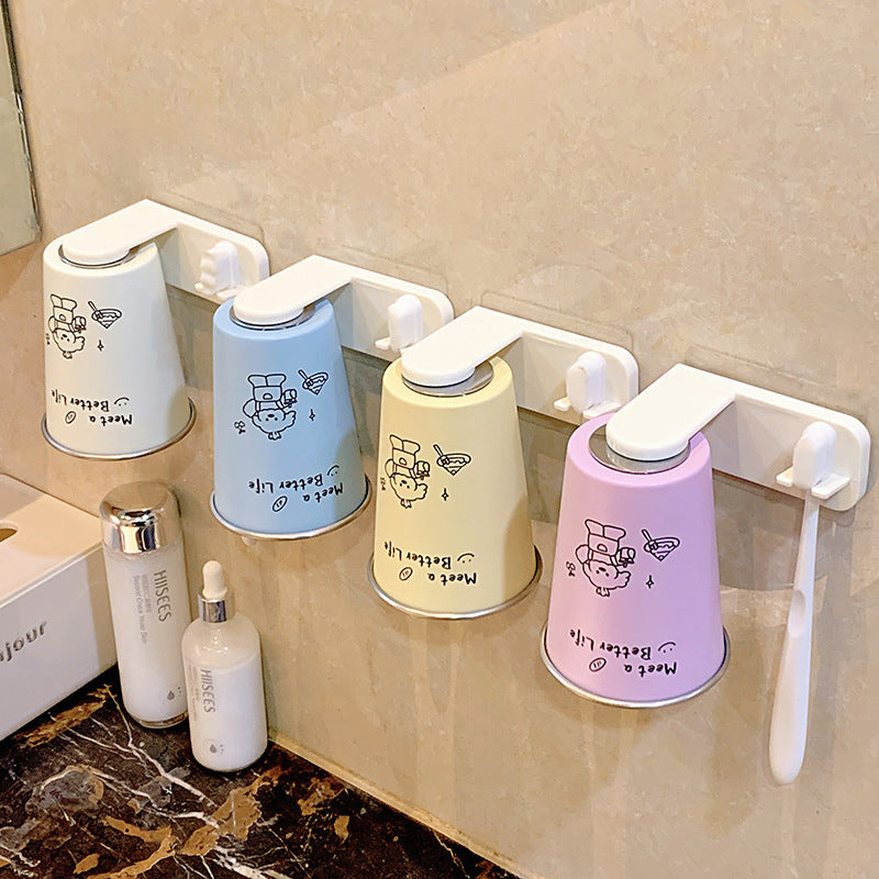 Wall-mounted toothbrush holder with playful design Kalsten