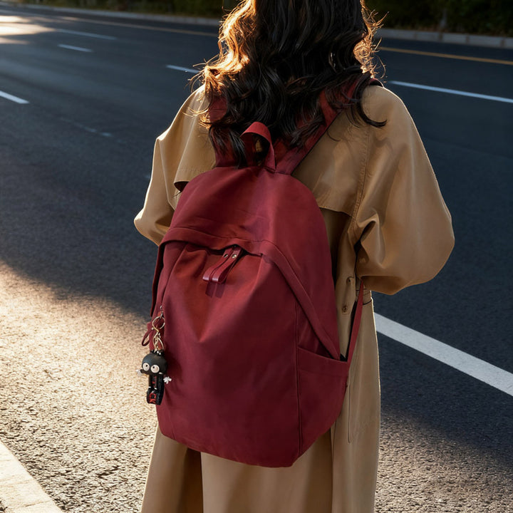 Fashionable backpack with practical design and decorative pendant Kalsten