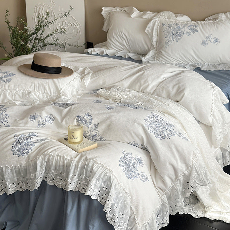 Embroidered bedding set in country house style with ruffled edging and eyelet lace