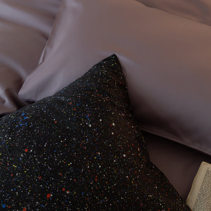 Luxurious cotton satin bedding set with contrasting patterned pillows