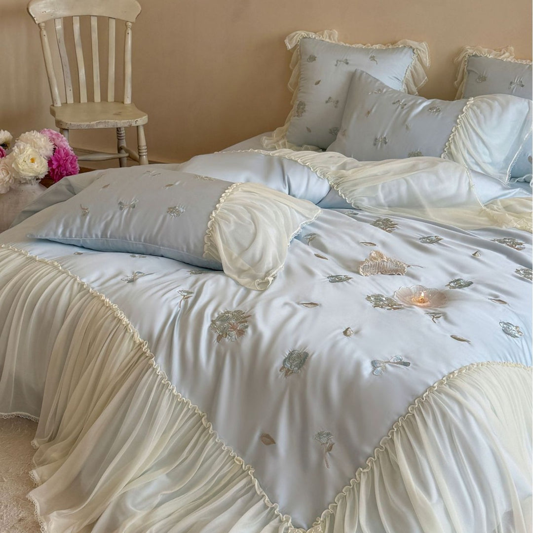 Romantic embroidered bedding set with ruffled frill and tulle overlay