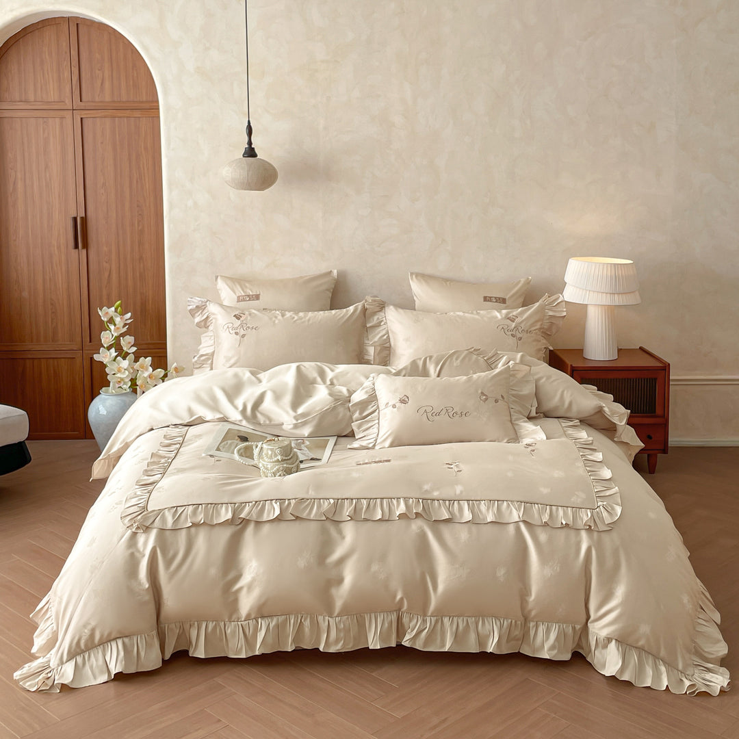 Romantic satin bedding set with ruffles, fine floral embroidery, and reversible pillowcase