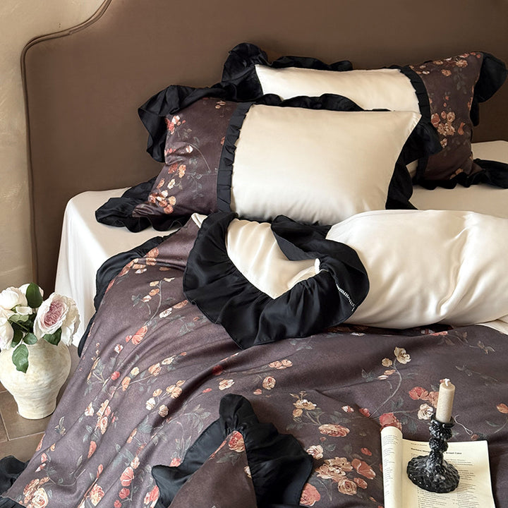 Reversible cotton satin bedding set with floral design and decorative ruffle trim