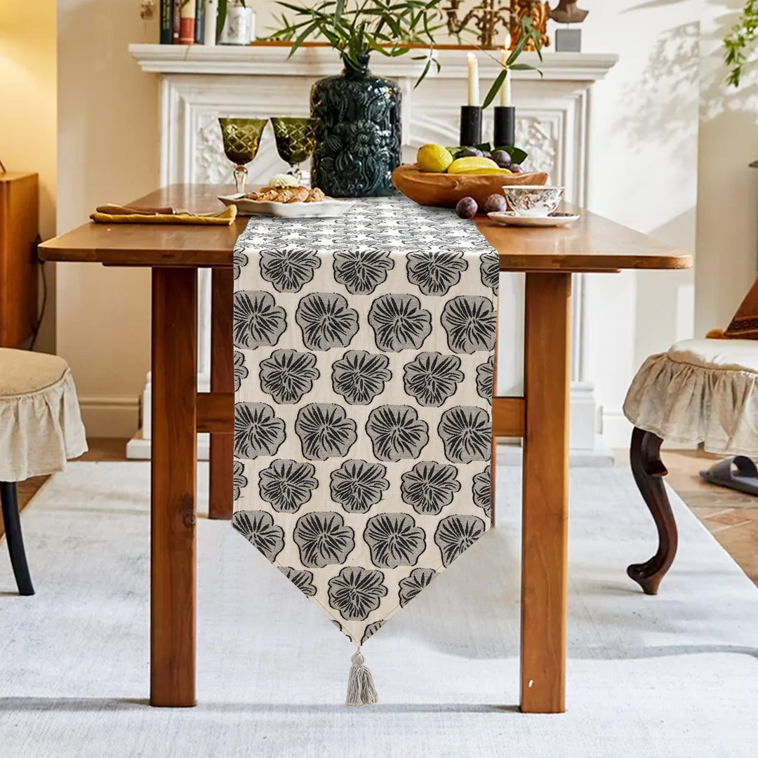 Elegant linen table runner with tassels and decorative print