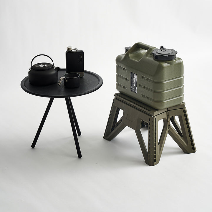 Compact foldable step stool made of shatterproof plastic with carrying handle and non-slip feet