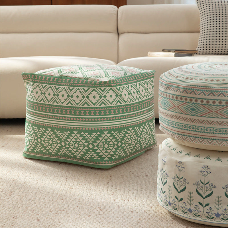 Round floor pouf with ethnic weaving pattern and practical carrying handle Kalsten