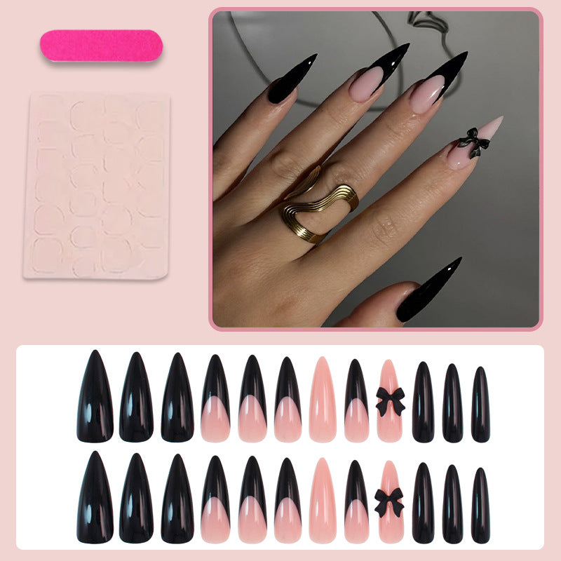 Acrylic nail set with elegant black-and-white design and playful accents Kalsten