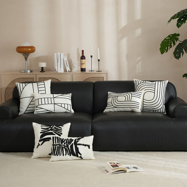 Decorative cushion cover with textured embroidery and geometric line motif