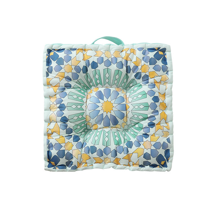 Round floor cushion with medal print, carrying handle and quilted padding