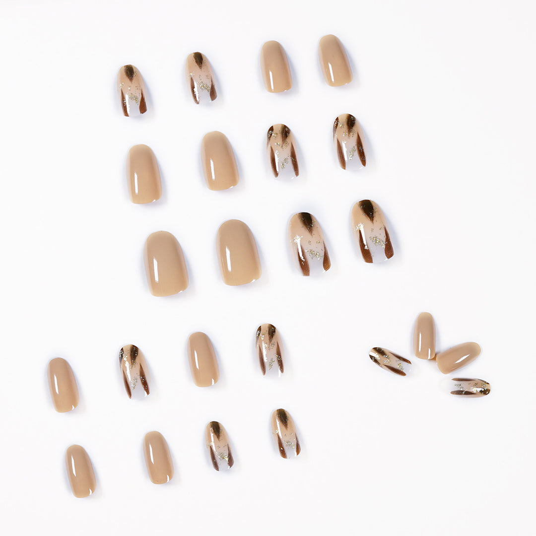 Artificial nail extensions with modern design and glitter accents Kalsten