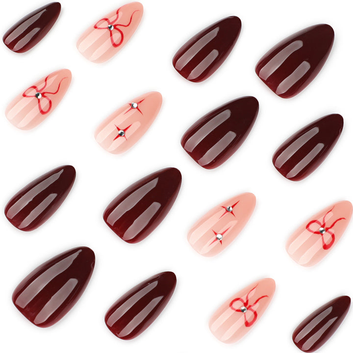 Artful nail art with elegant bows and rhinestone embellishments Kalsten