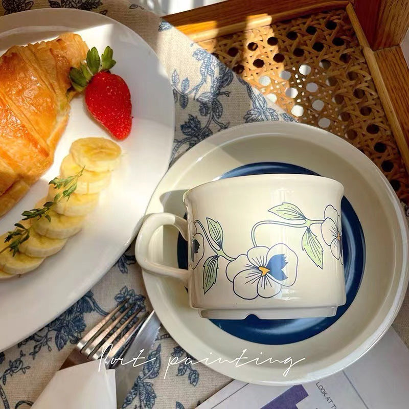 Fine porcelain tea cup with saucer and delicate floral motif