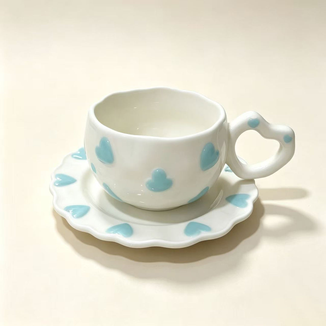 Porcelain cup set with heart-shaped handle and embossed decorative hearts