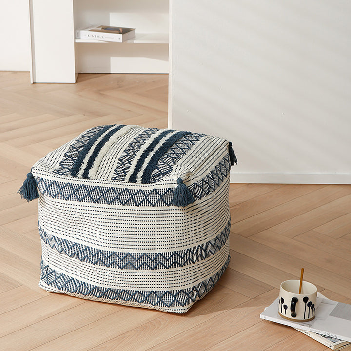 Braided square floor seat pouf with tassels and woven ethnic pattern