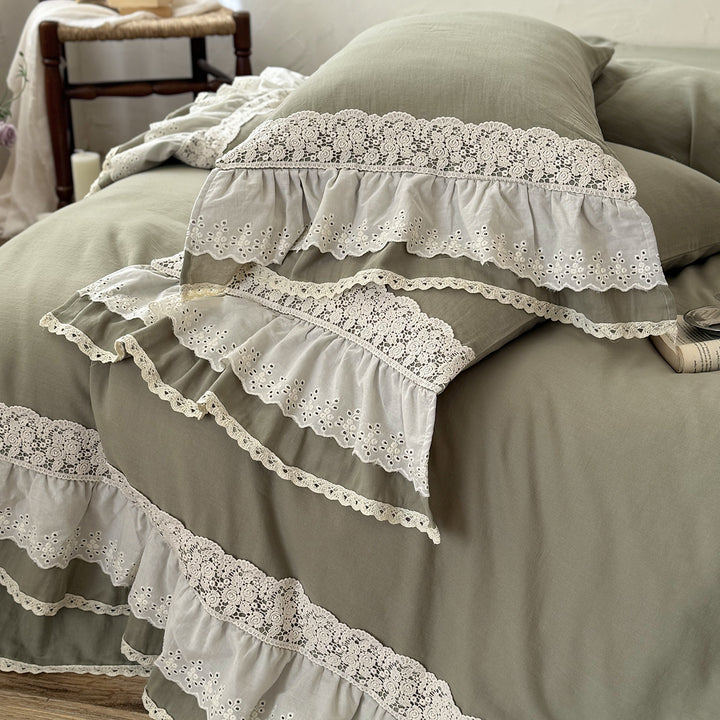 Romantic bedding set in country house style with ruffles and lace trim