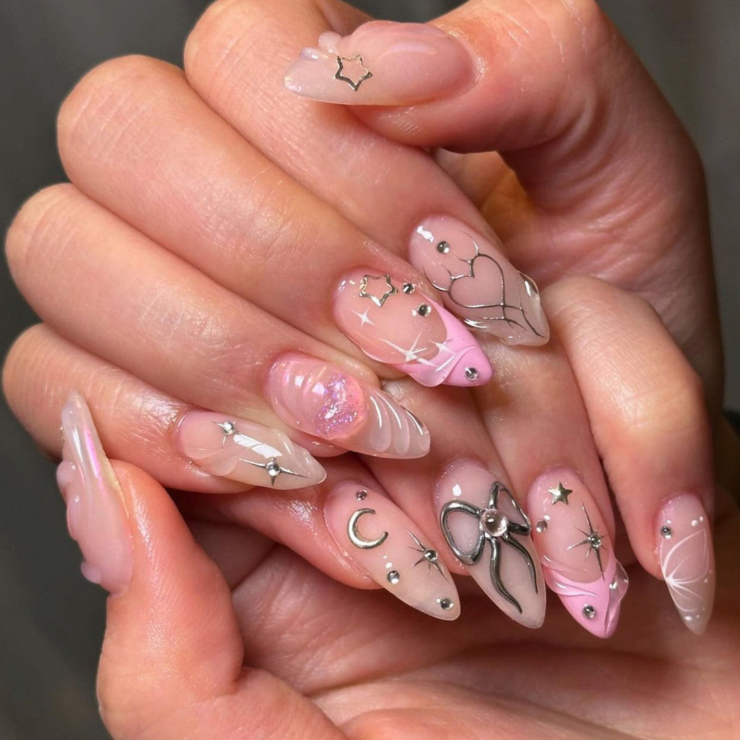 Artful nail art with filigree designs and glitter accents Kalsten