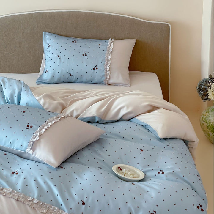 Satin bedding set with delicate ruffles and cherry pattern
