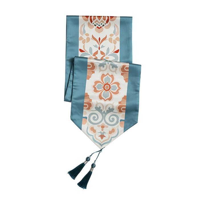 Handcrafted satin table runner with Oriental medallion pattern and decorative tassels