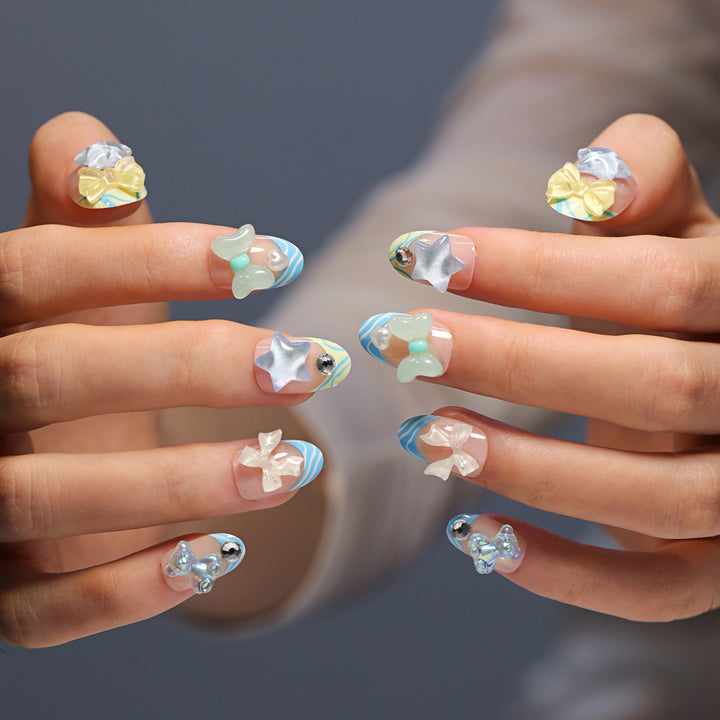 Artificial nail art with colorful pastel designs and 3D embellishments Kalsten