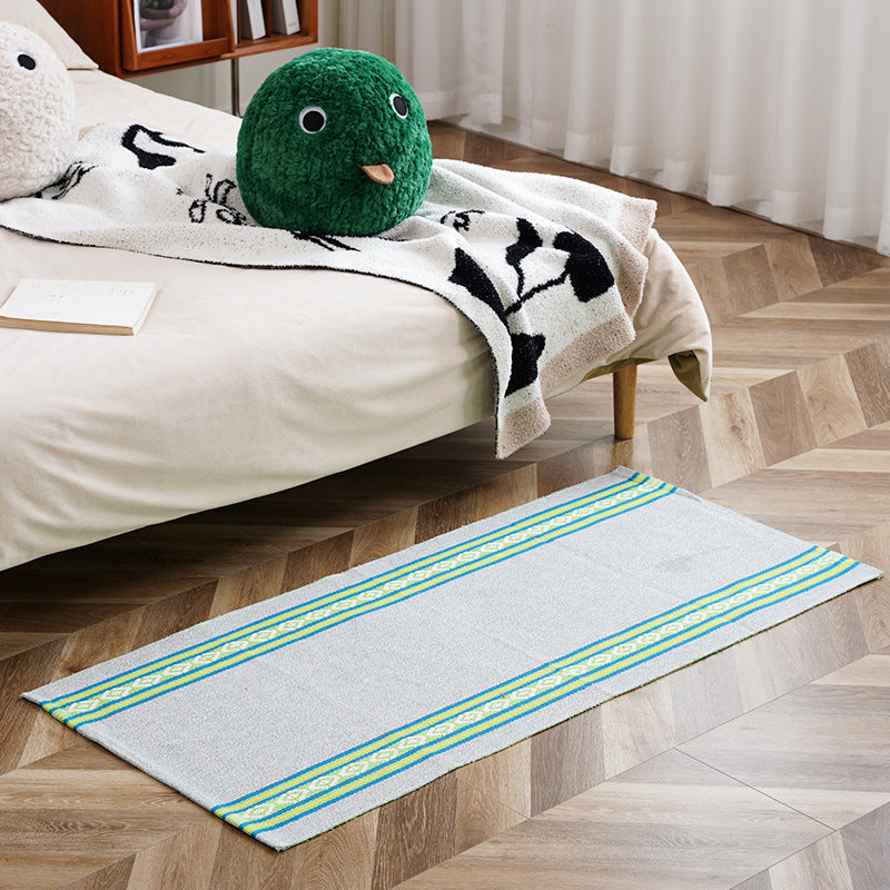 woven living room runner with fringes and geometric weave pattern