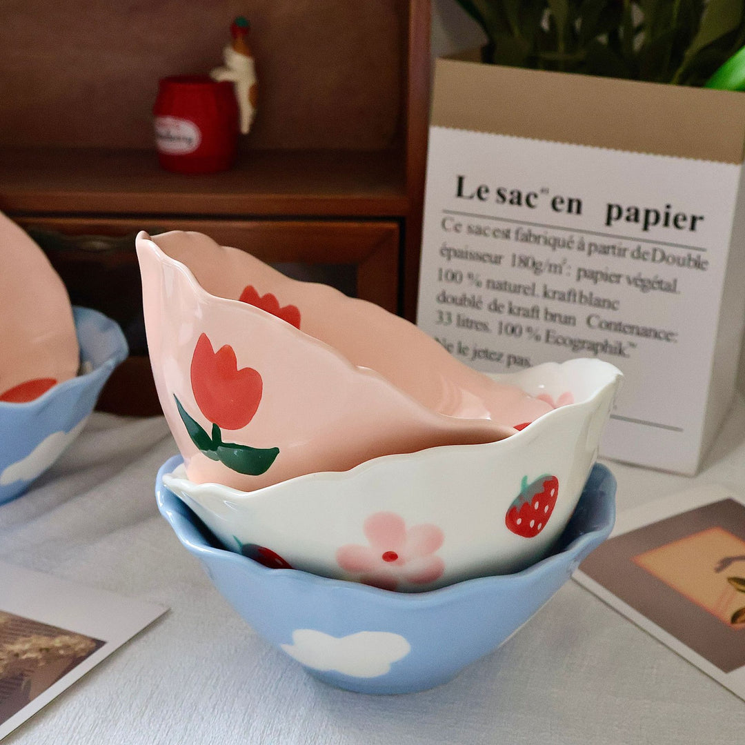 Decorative hand-painted ceramic bowl with wavy edge and tulip design